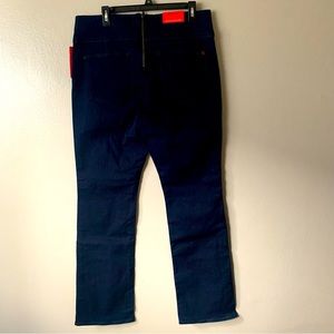 Women SPANX Signature Waist Slim Boot Zip In Back Jeans in Midnight Rinse.